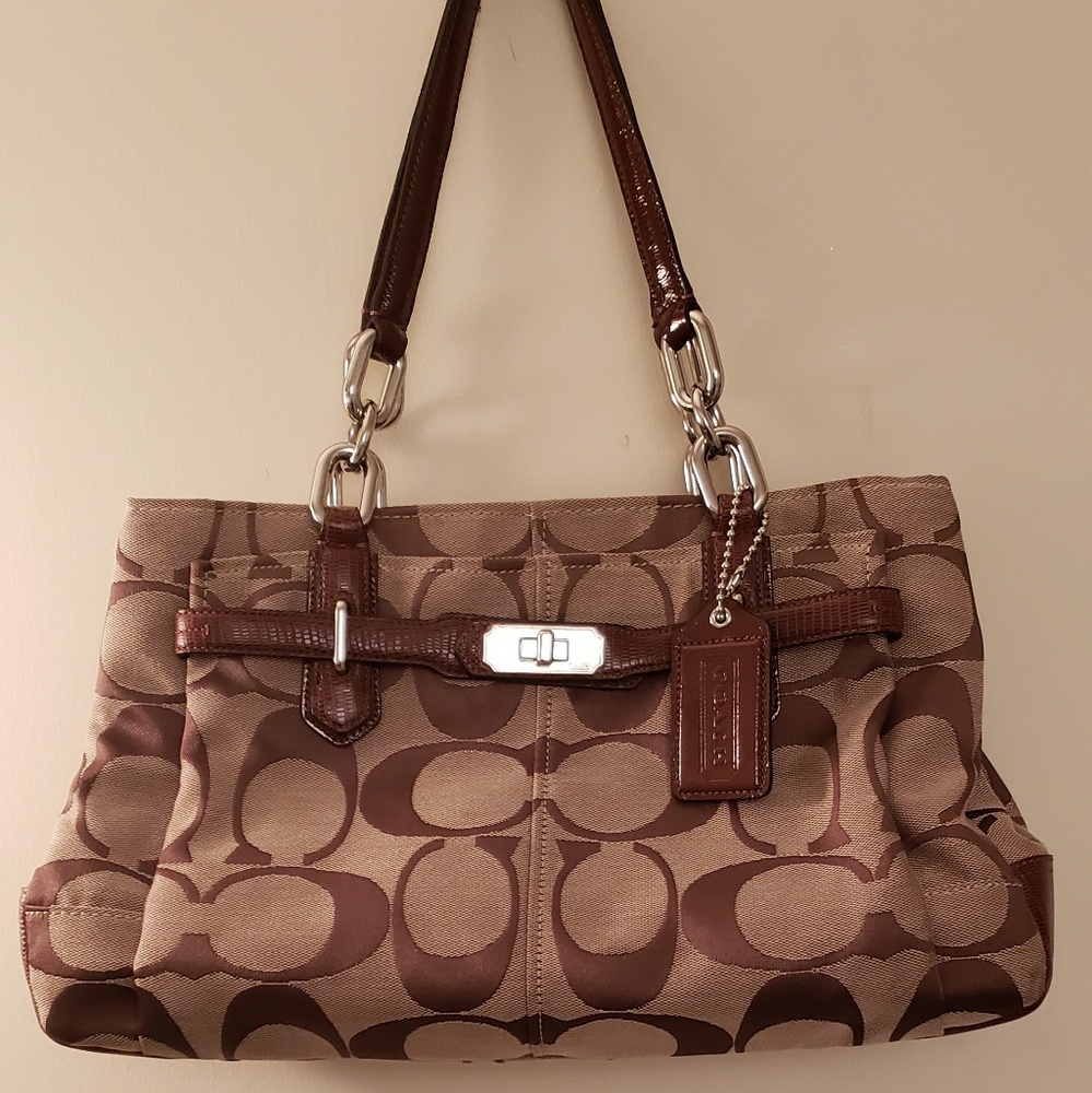 Coach brown 3 compartments and front pocket.